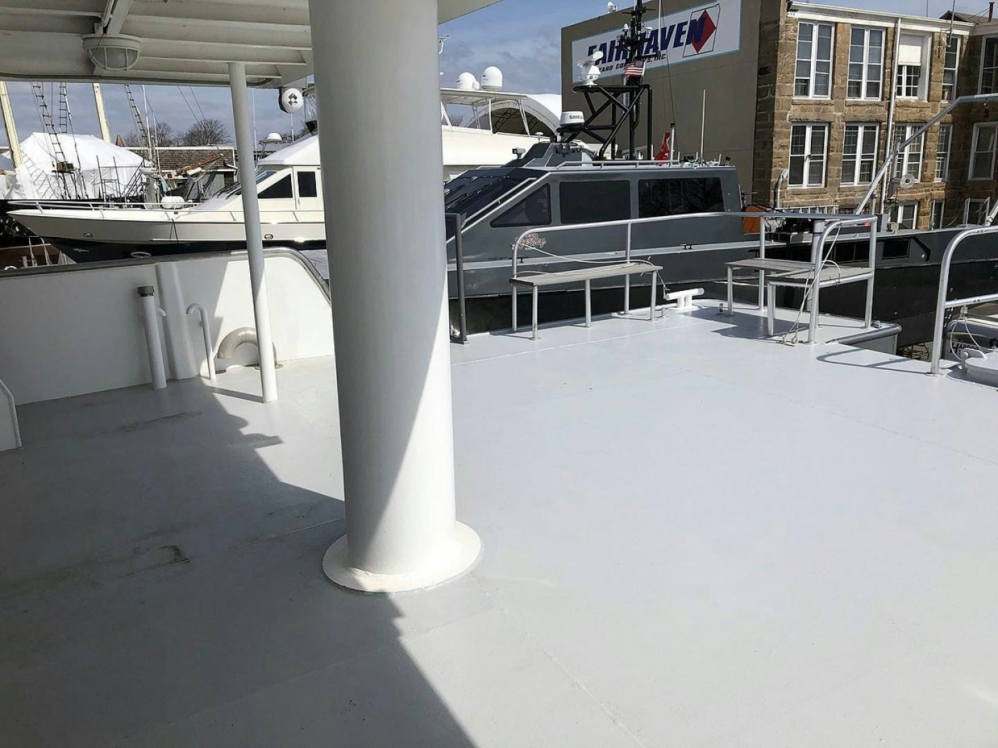 a white table on a white surface aboard CARE BEAR Yacht for Sale