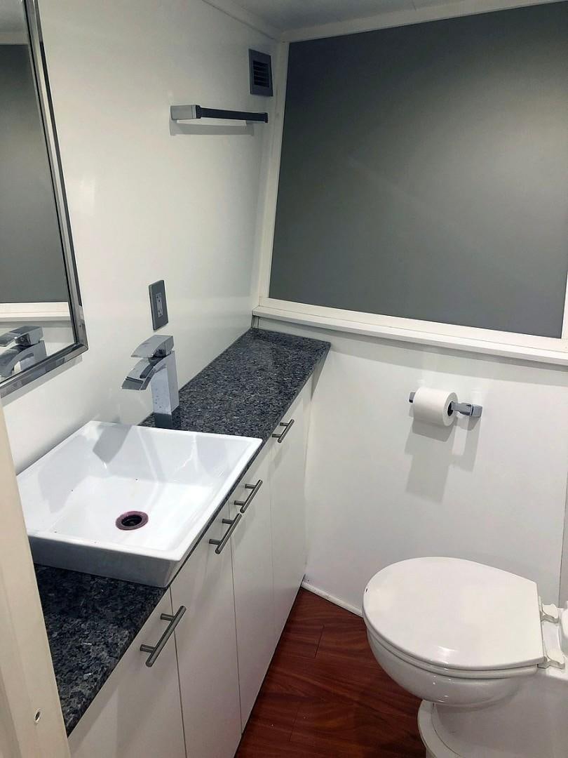 a bathroom with a sink and a toilet aboard CARE BEAR Yacht for Sale