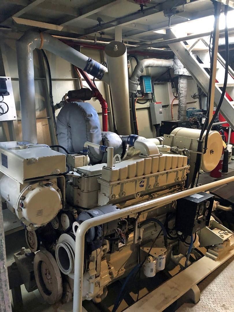 a person working in a factory aboard CARE BEAR Yacht for Sale