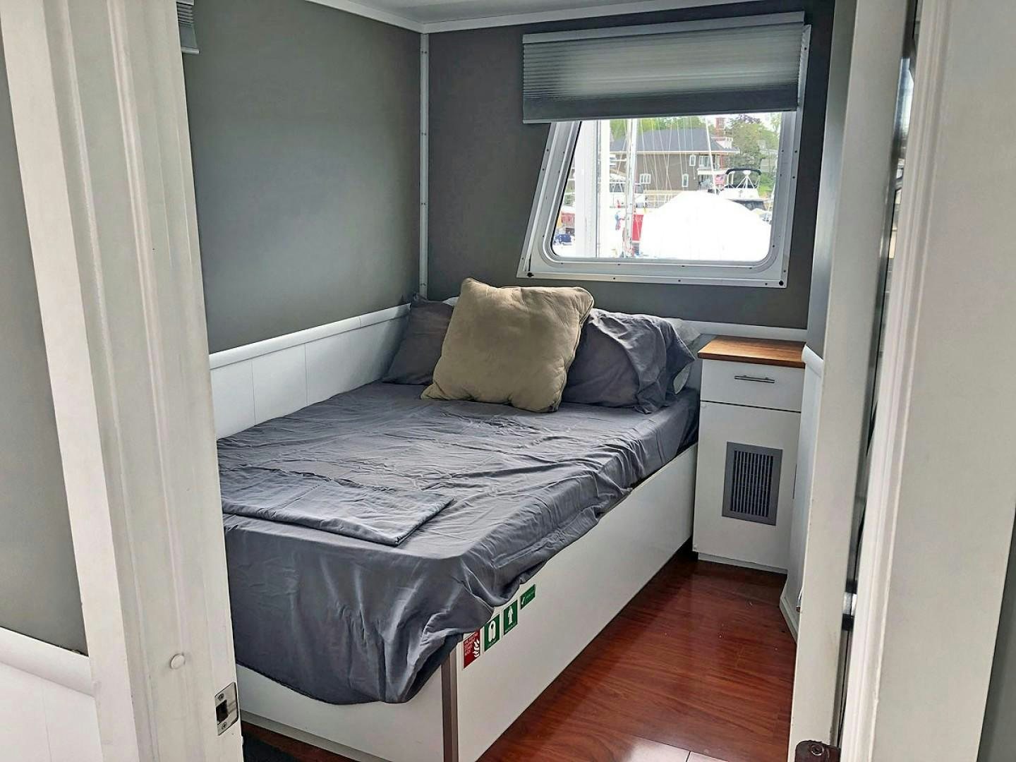 a bed in a room aboard CARE BEAR Yacht for Sale