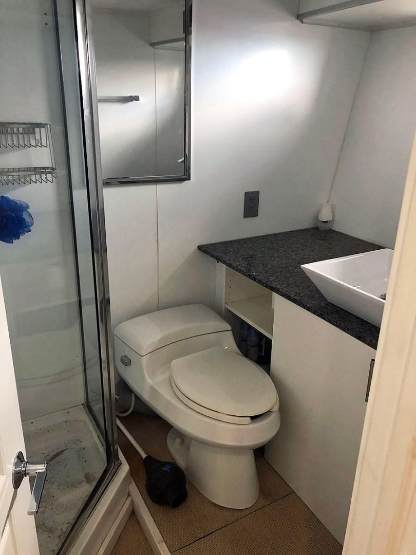 a bathroom with a sink and a toilet aboard CARE BEAR Yacht for Sale