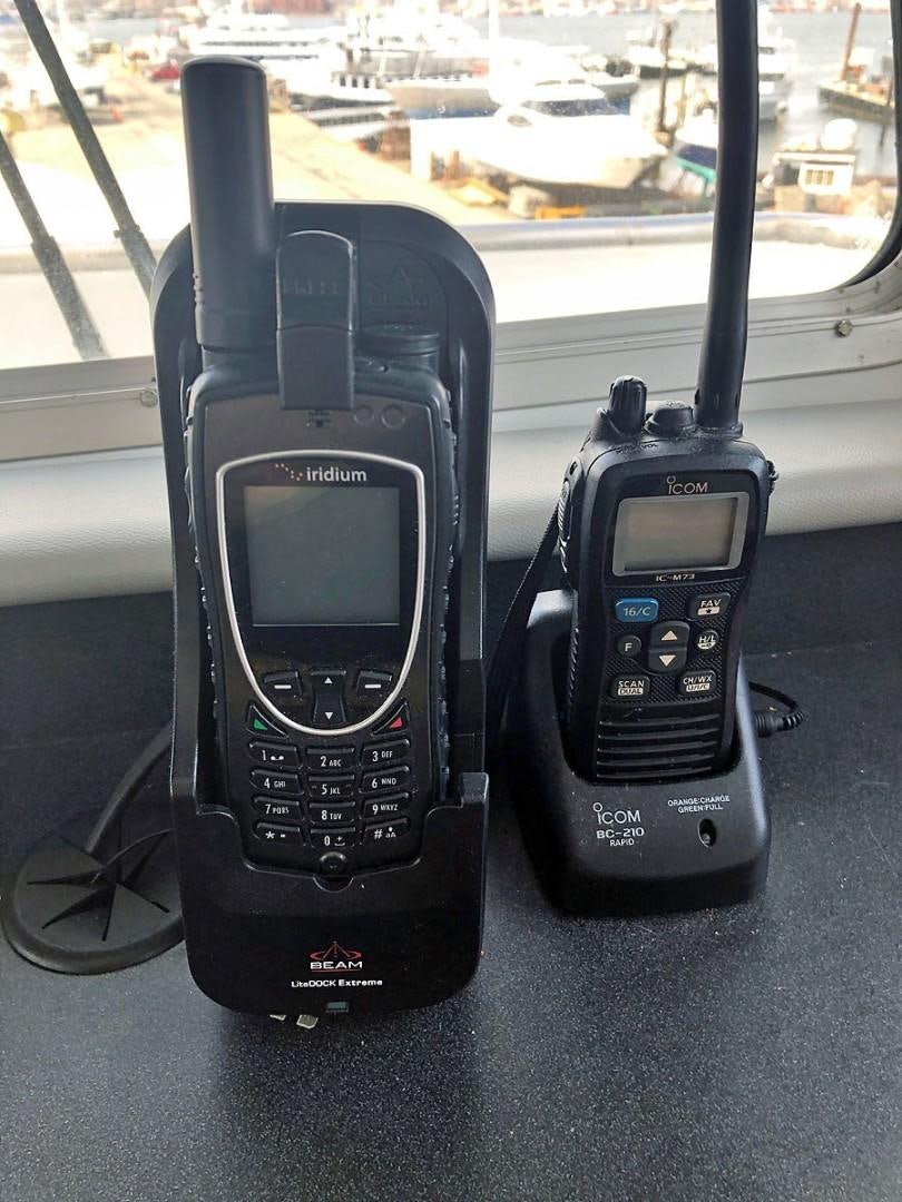 a couple of cell phones sit on a table aboard CARE BEAR Yacht for Sale
