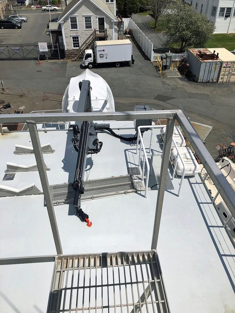 a metal sculpture on a metal stand aboard CARE BEAR Yacht for Sale