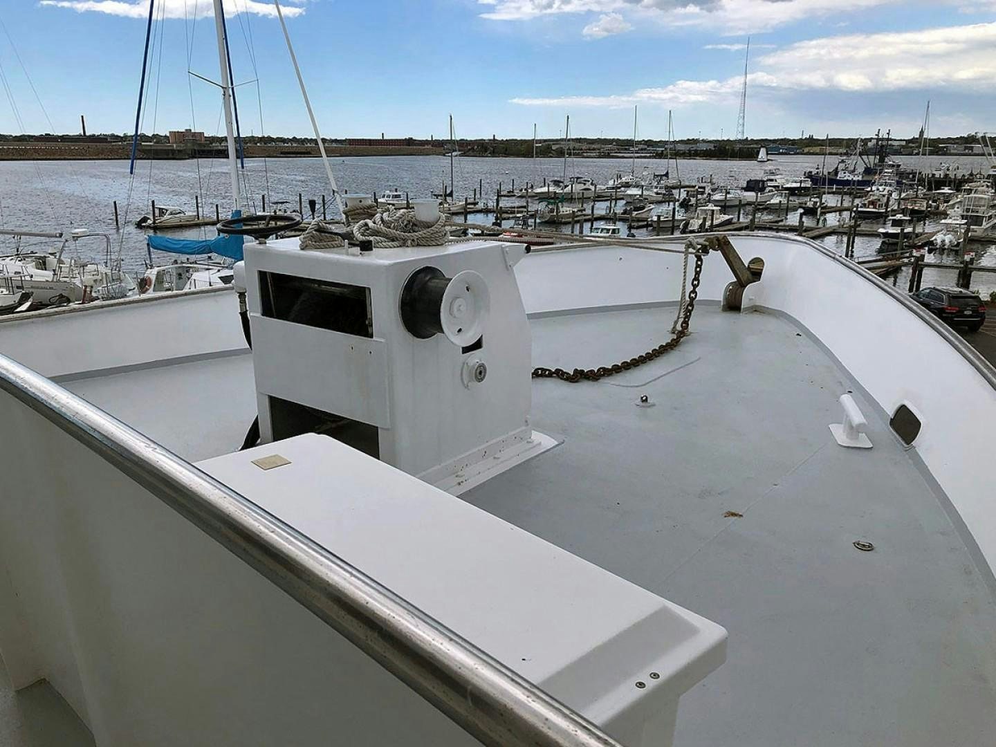 a boat in a harbor aboard CARE BEAR Yacht for Sale