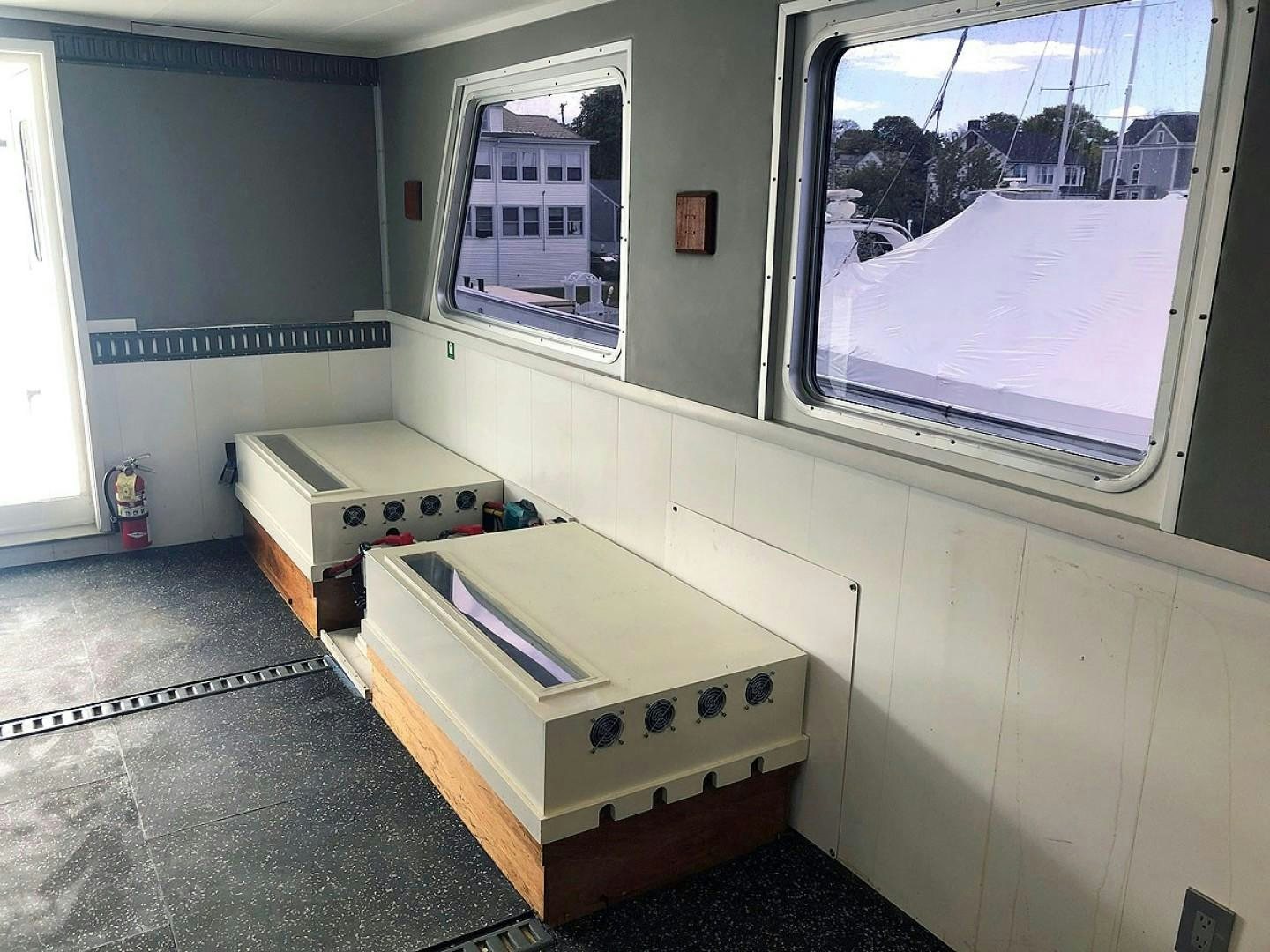 a white machine with a window aboard CARE BEAR Yacht for Sale