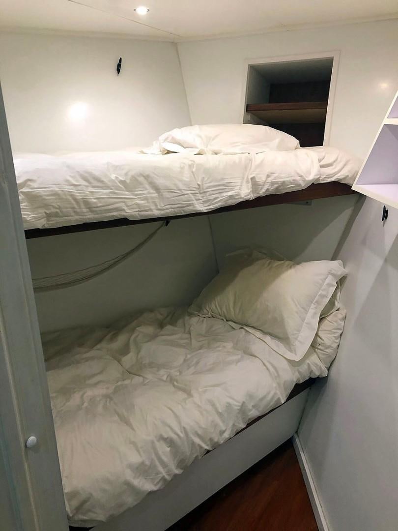 a room with two beds aboard CARE BEAR Yacht for Sale