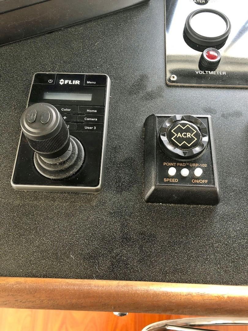 a close-up of a car stereo aboard CARE BEAR Yacht for Sale