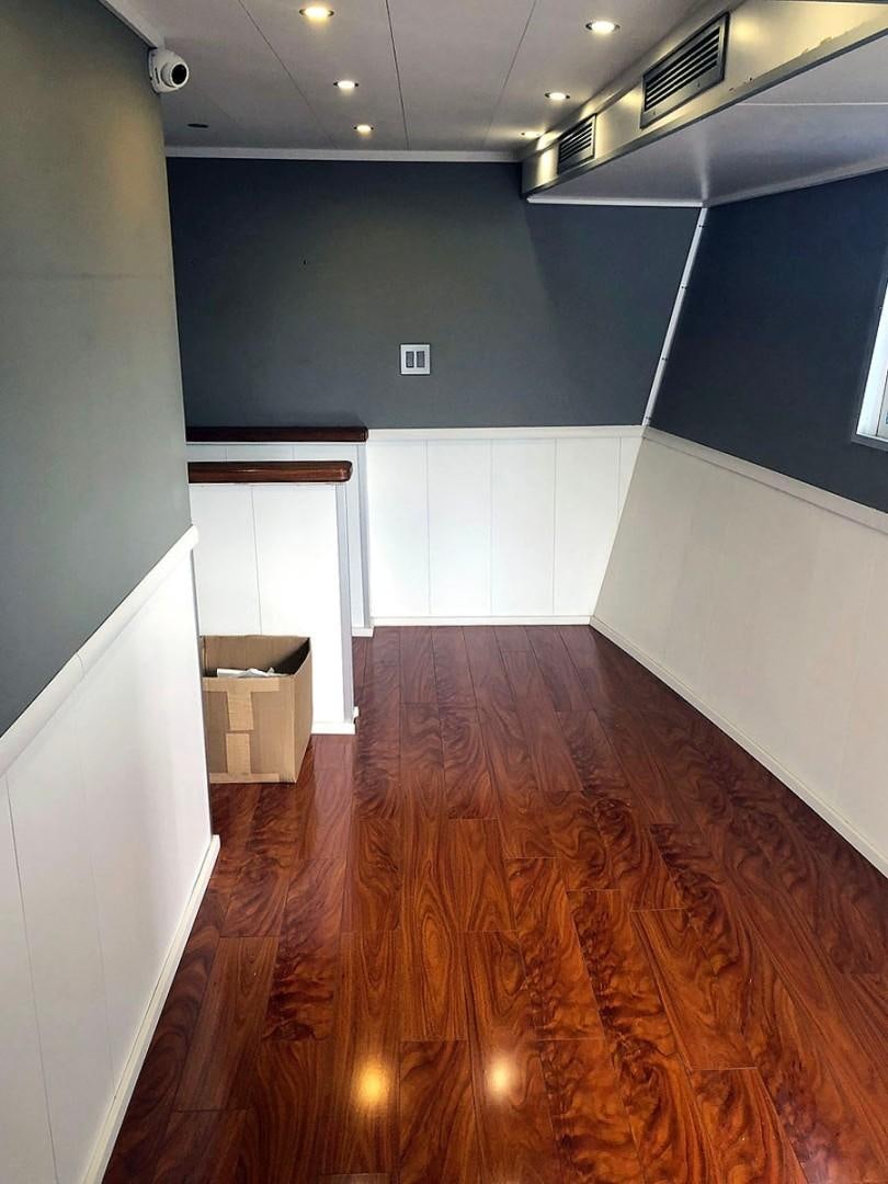 a room with a wood floor and a wood floor aboard CARE BEAR Yacht for Sale