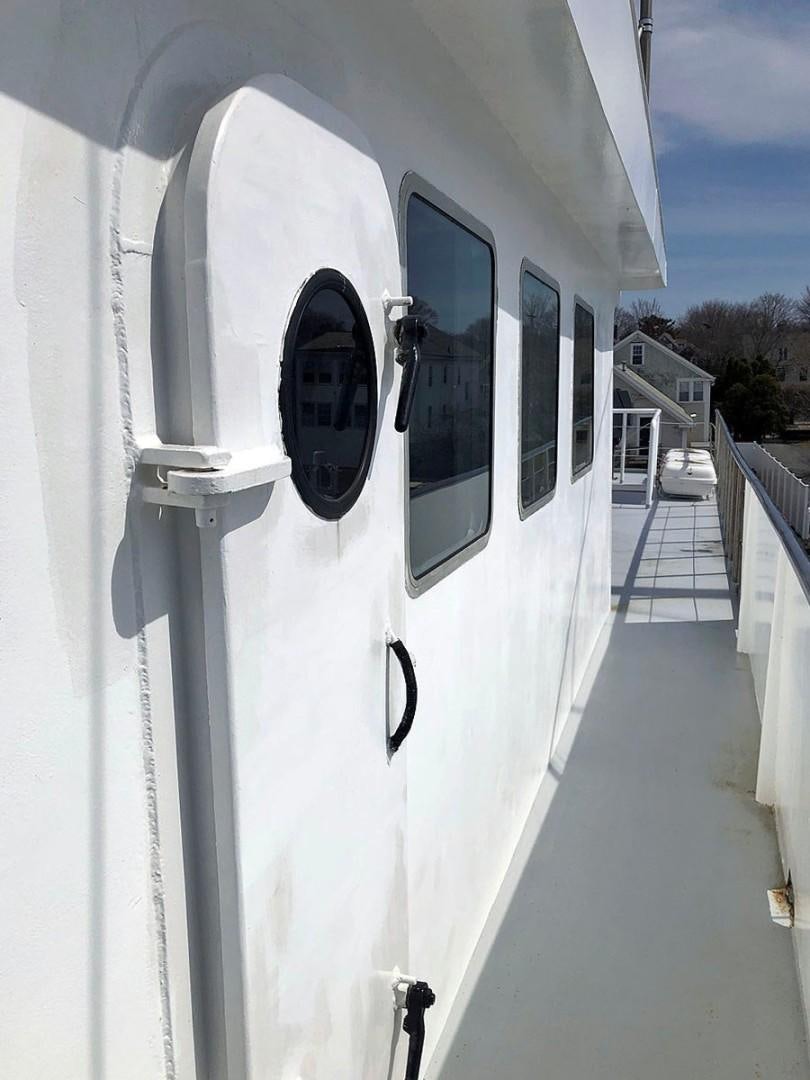 a large white door aboard CARE BEAR Yacht for Sale