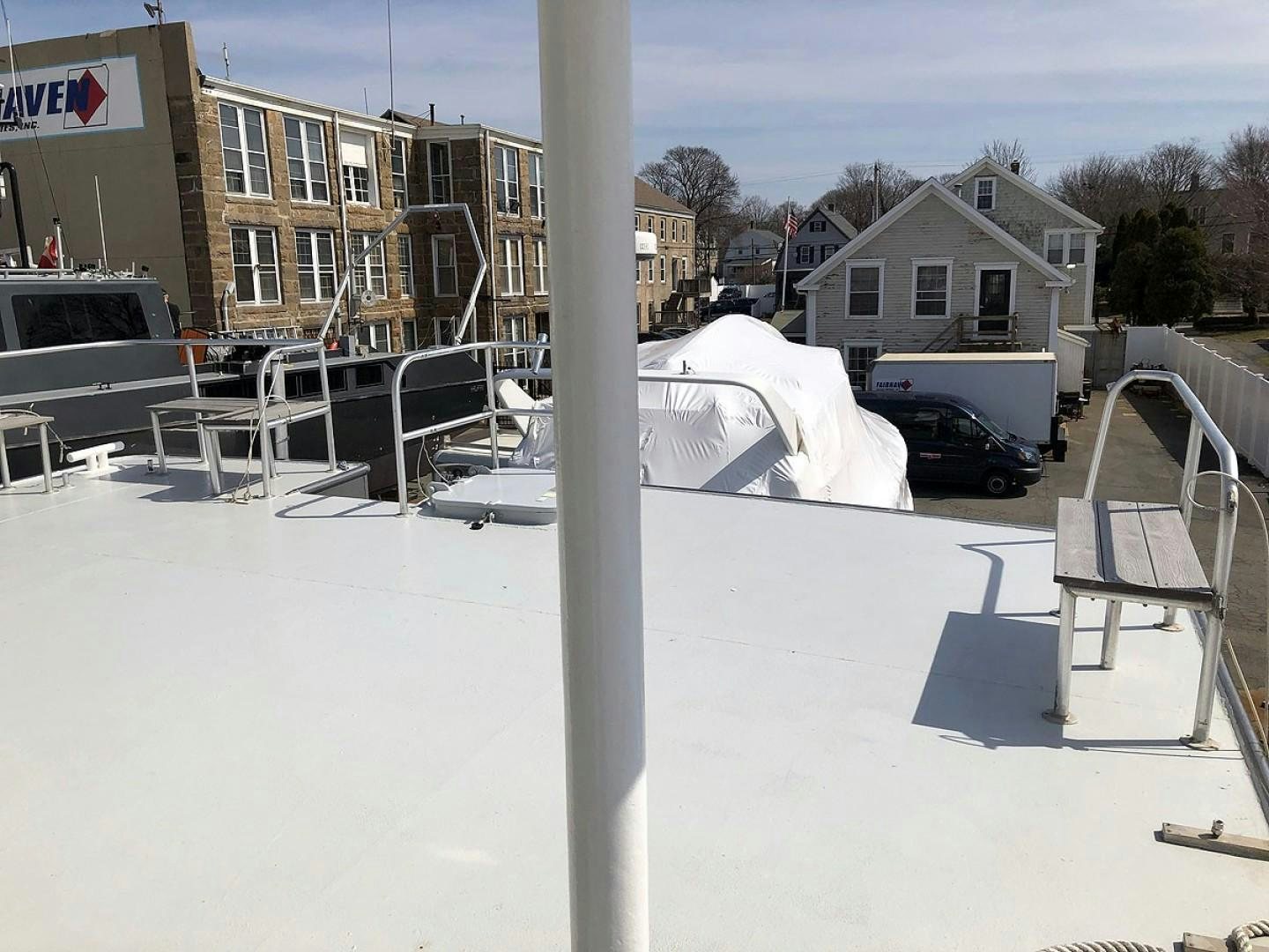 a group of white tents outside aboard CARE BEAR Yacht for Sale