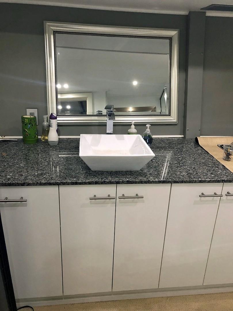 a bathroom with a large mirror aboard CARE BEAR Yacht for Sale