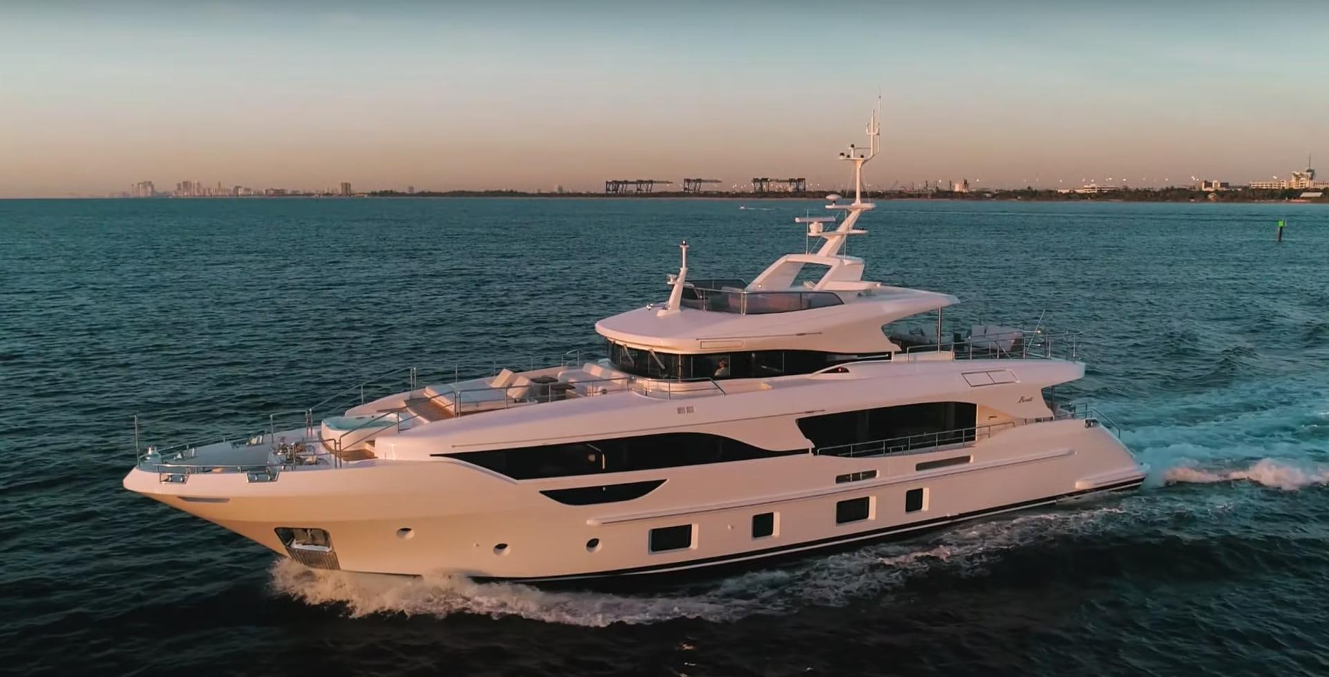 a white yacht in the water aboard Benetti 95 Delfino Yacht for Sale