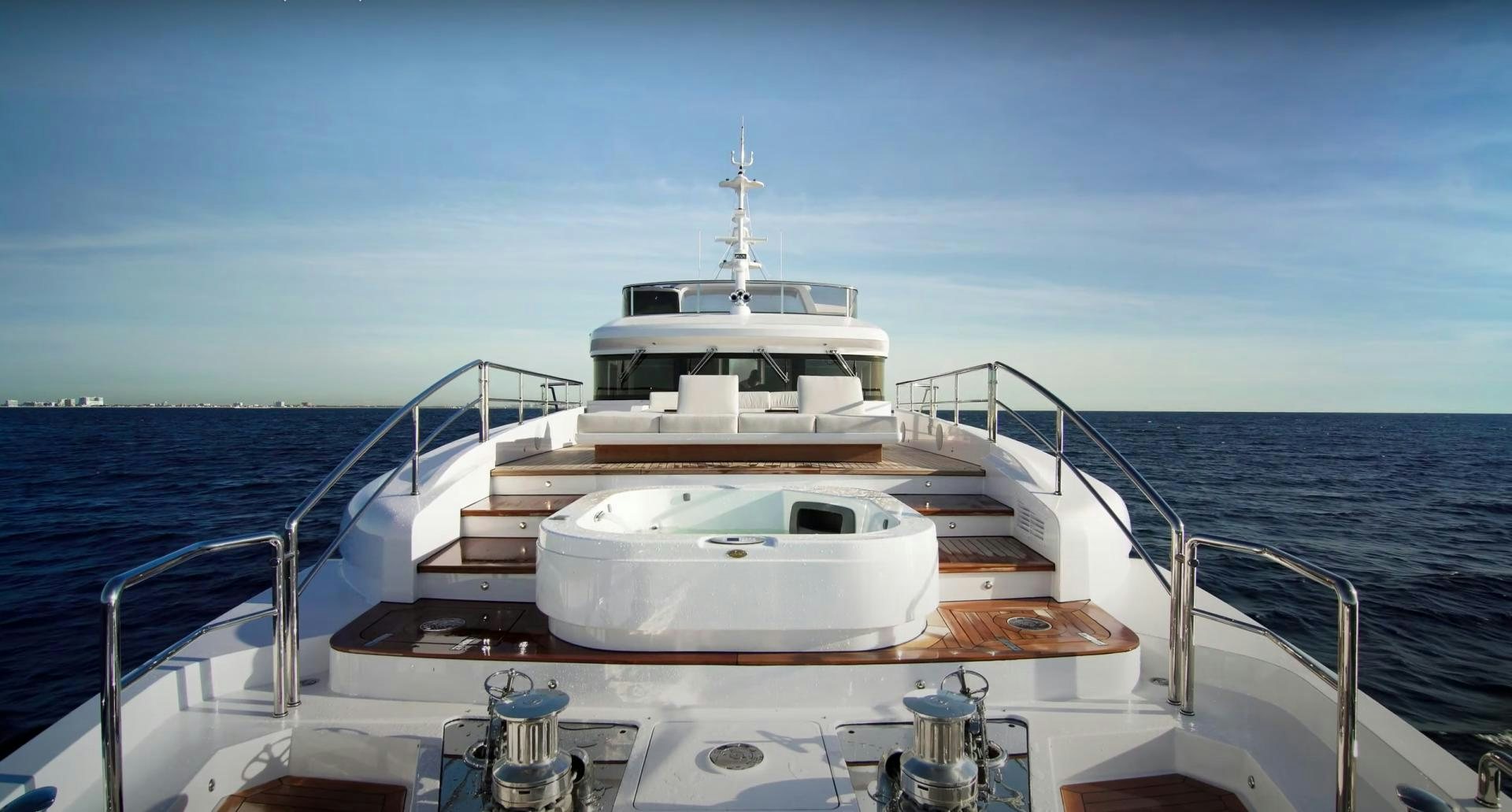 a boat on the water aboard Benetti 95 Delfino Yacht for Sale