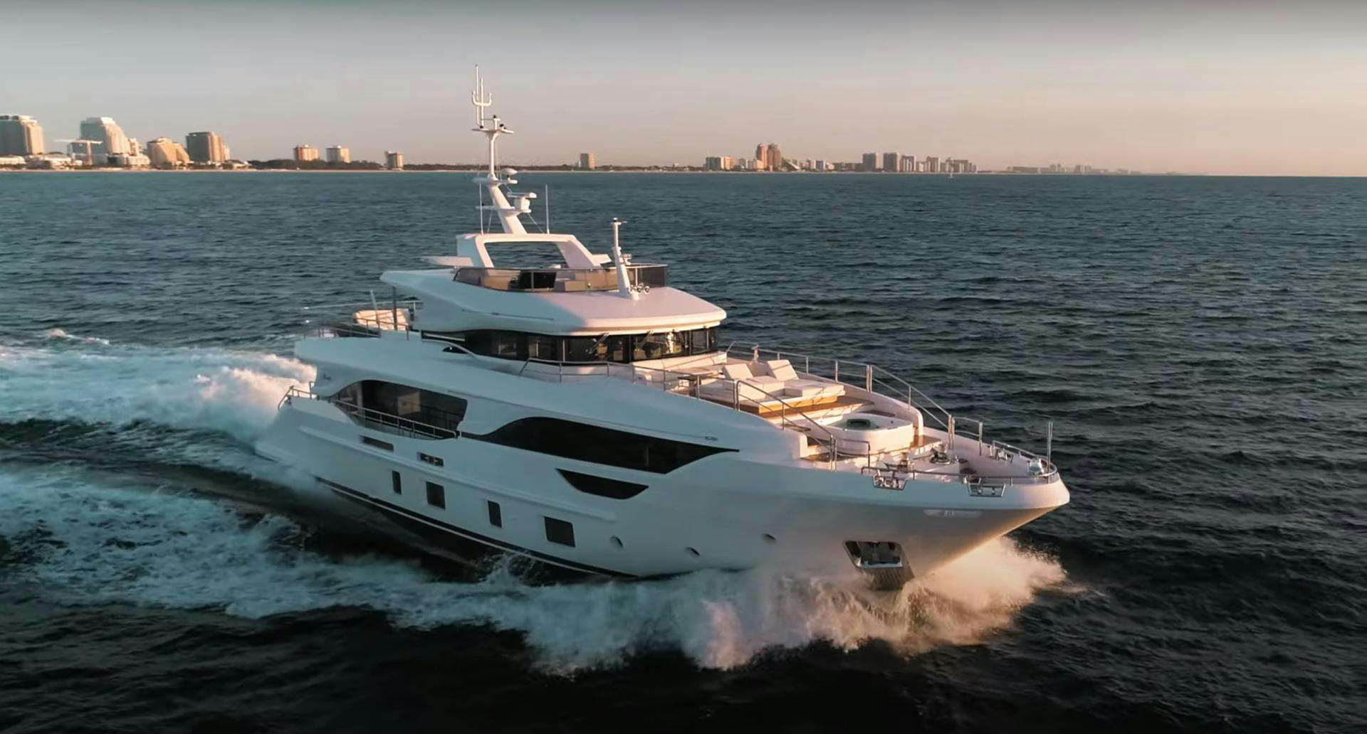 a boat on the water aboard Benetti 95 Delfino Yacht for Sale