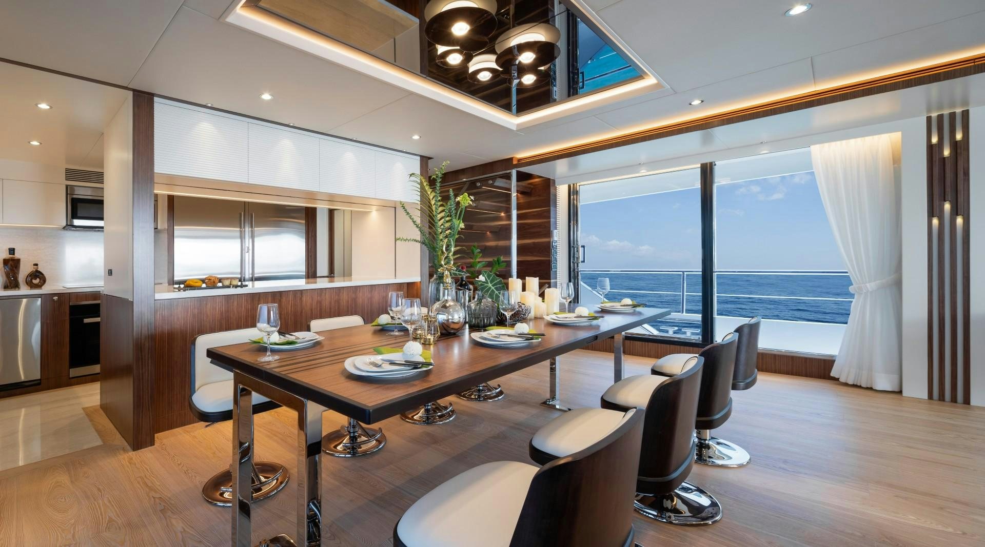 a large room with a table and chairs aboard FD92 219 Yacht for Sale