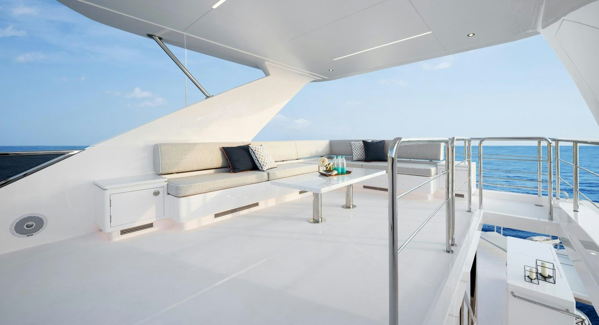 a white room with a couch and a table and chairs aboard FD92 219 Yacht for Sale