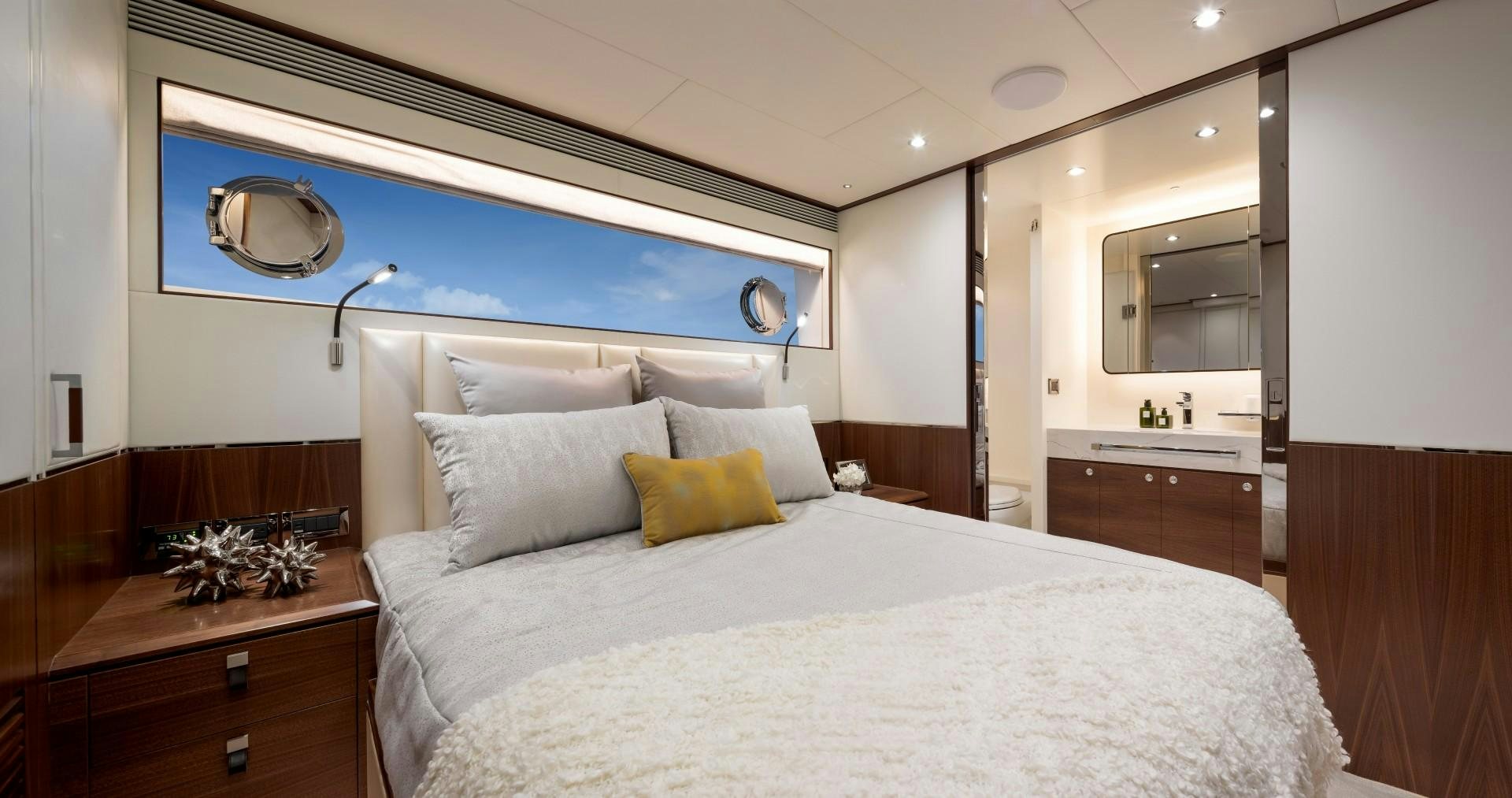 a bed with white sheets and pillows aboard FD92 219 Yacht for Sale