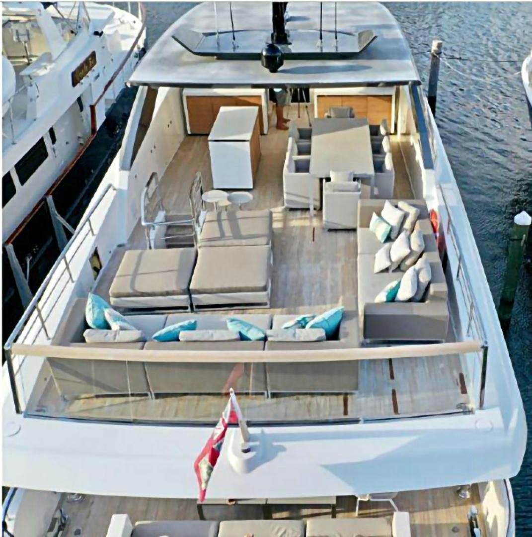 a large boat with chairs on it aboard No Name Yacht for Sale