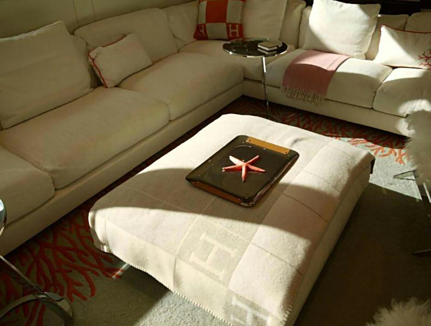 a couch with a red star aboard No Name Yacht for Sale