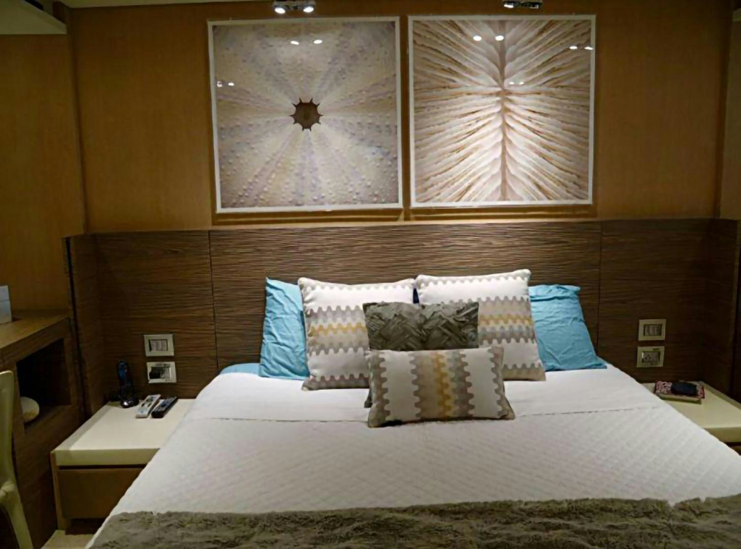 a bed with a white bed spread aboard No Name Yacht for Sale