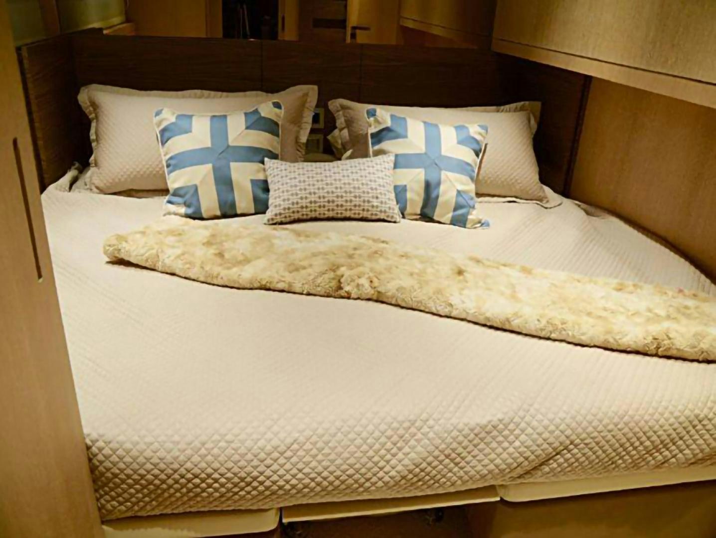 a bed with pillows aboard No Name Yacht for Sale