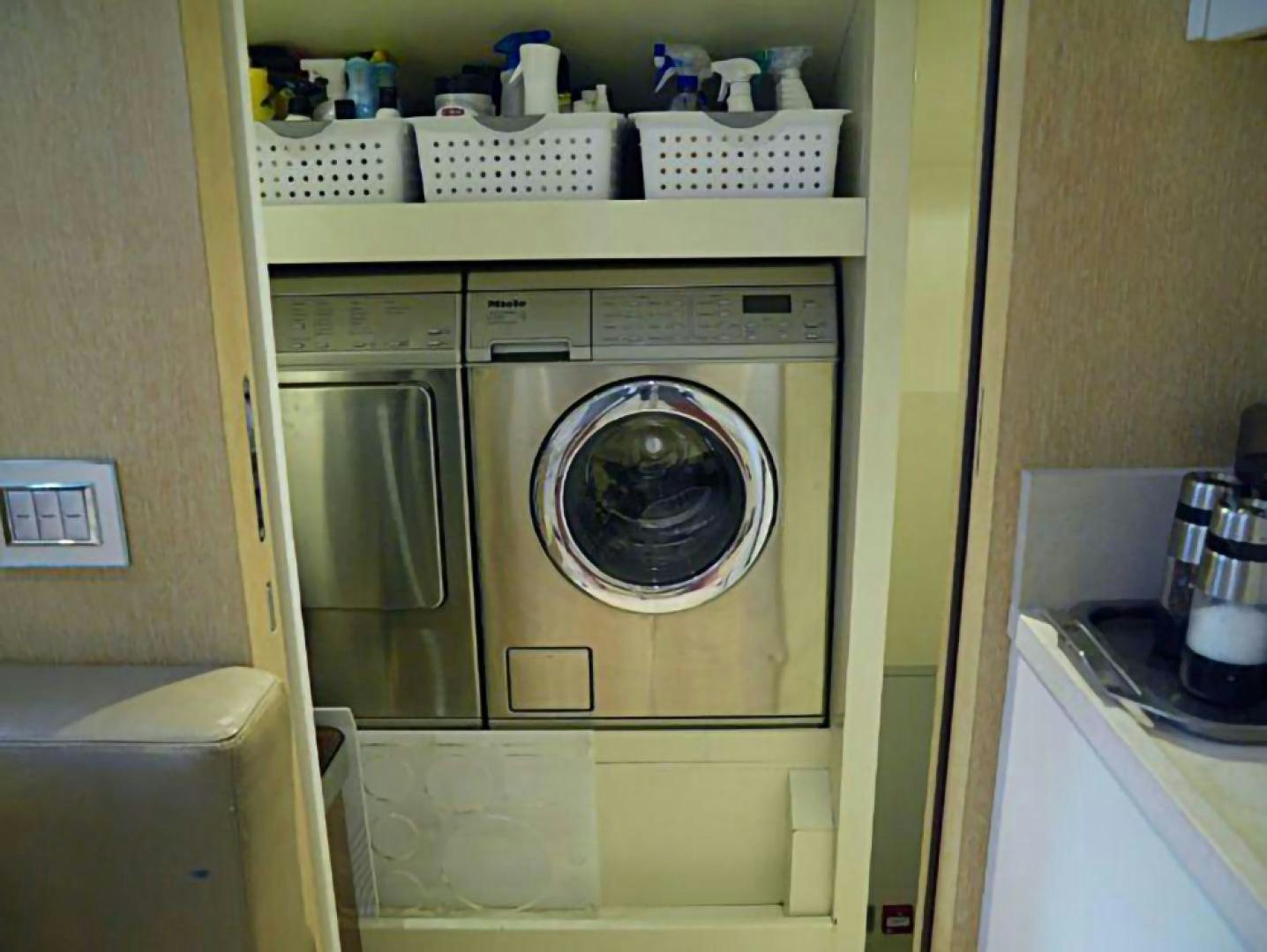 a washer and dryer in a room aboard No Name Yacht for Sale