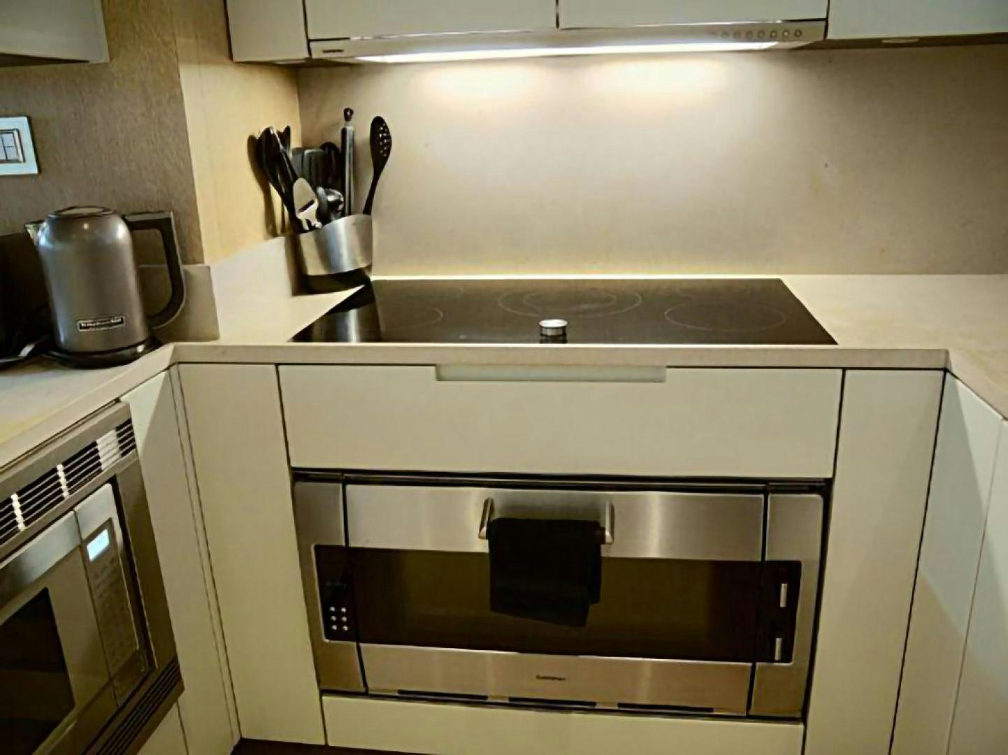 a kitchen with a stainless steel oven aboard No Name Yacht for Sale
