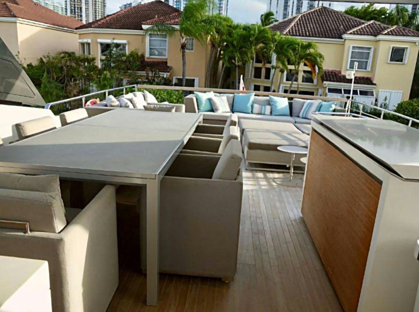 a group of tables and chairs outside aboard No Name Yacht for Sale