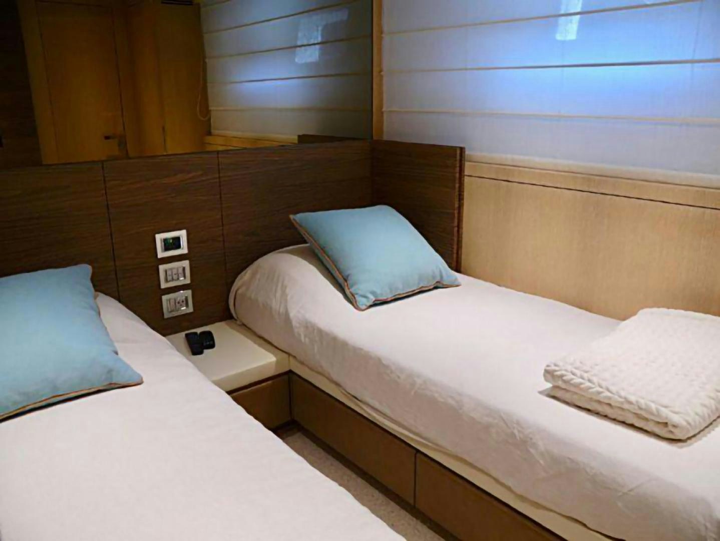 a room with beds and a window aboard No Name Yacht for Sale
