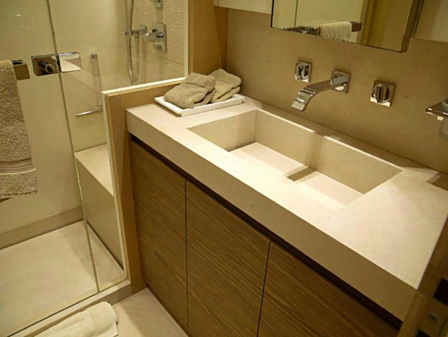 a bathroom with a sink and a mirror aboard No Name Yacht for Sale