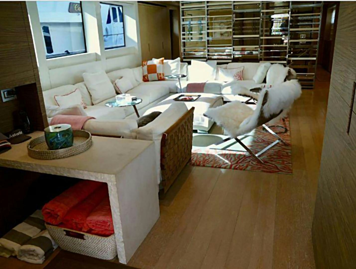 a living room with a couch and a coffee table aboard No Name Yacht for Sale