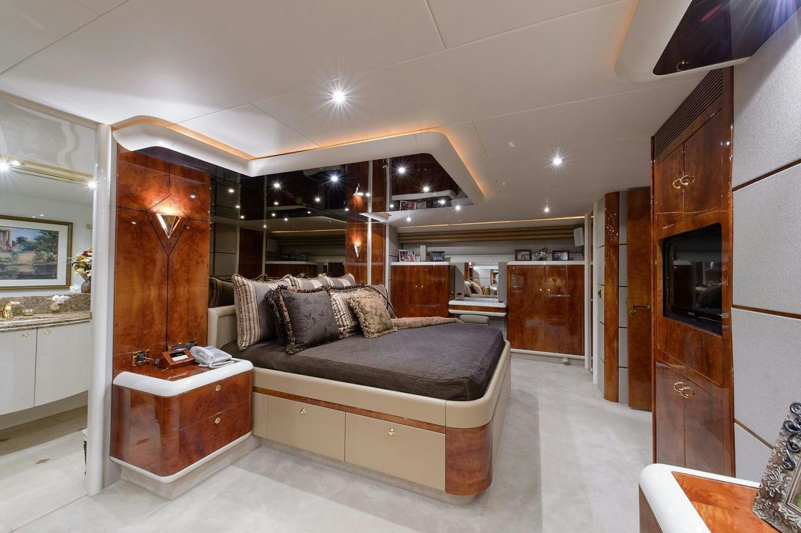 a living room with a couch and a tv aboard BIG WAVE Yacht for Sale