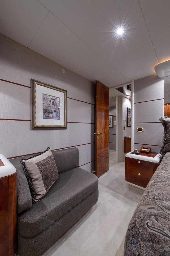 a couch in a room aboard BIG WAVE Yacht for Sale