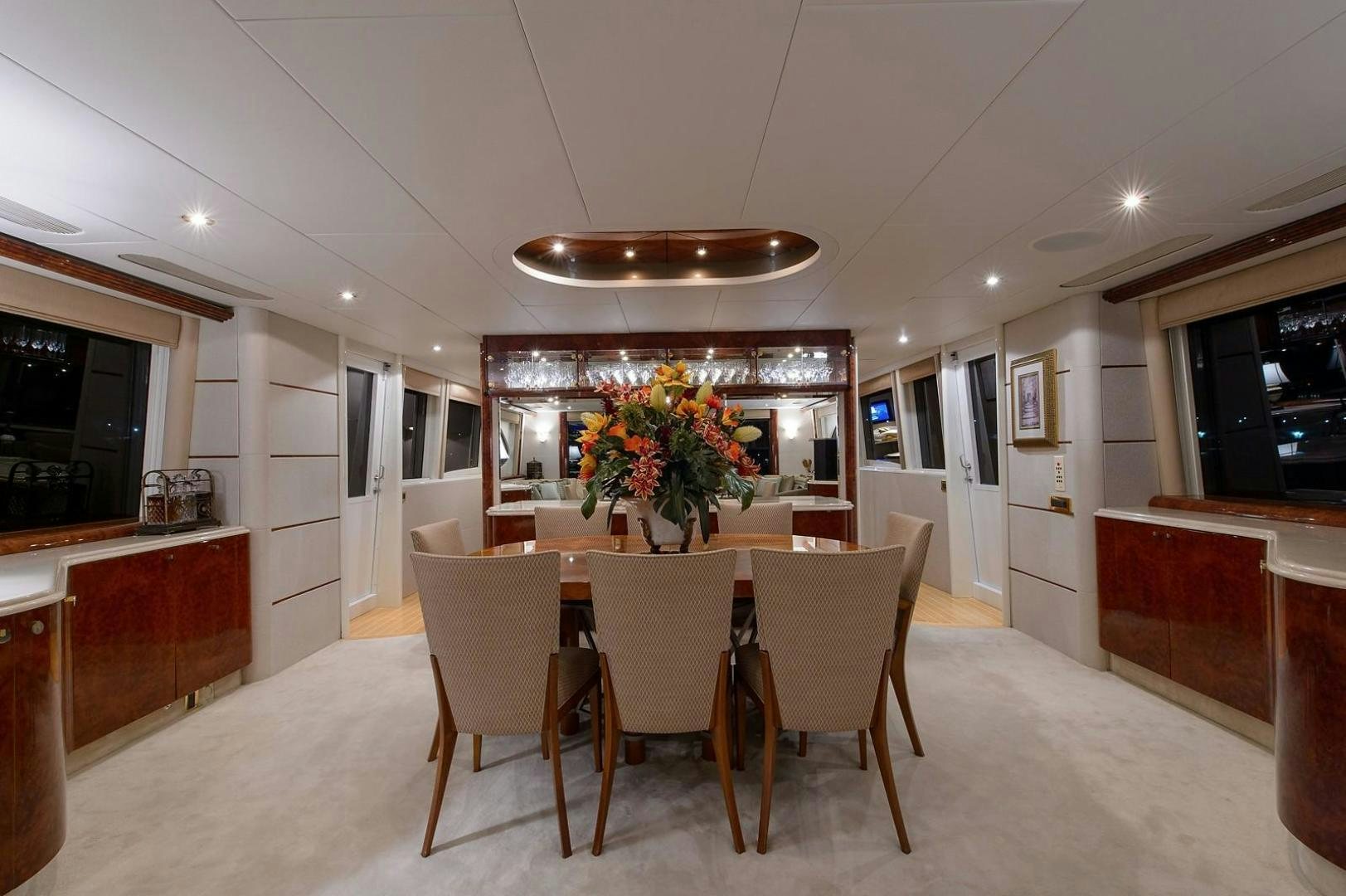 a dining room with a table and chairs aboard BIG WAVE Yacht for Sale