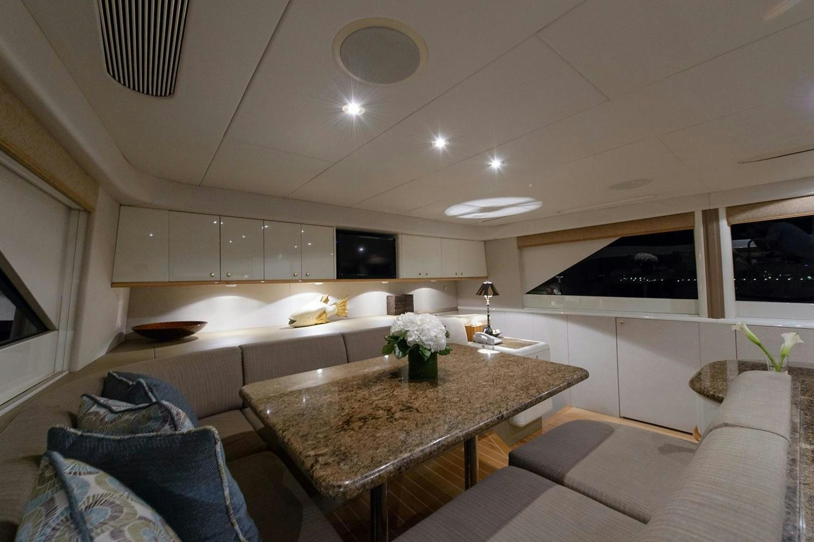 a modern looking kitchen with white cabinets aboard BIG WAVE Yacht for Sale