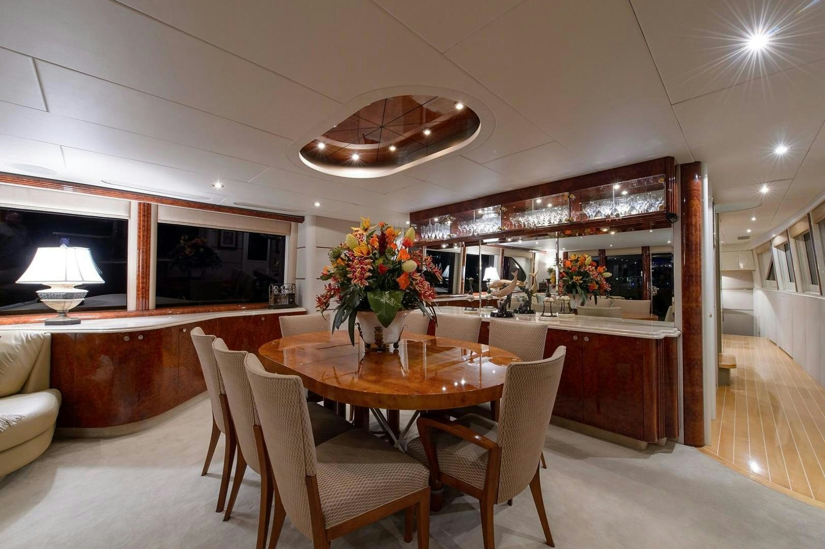 a dining room with a table and chairs aboard BIG WAVE Yacht for Sale