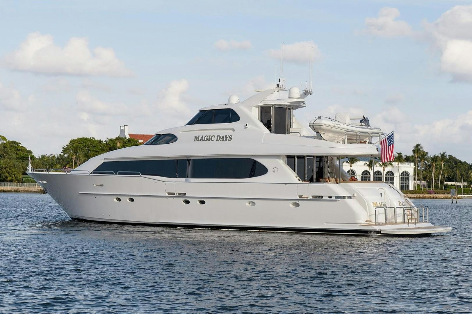 a white yacht on the water aboard BIG WAVE Yacht for Sale