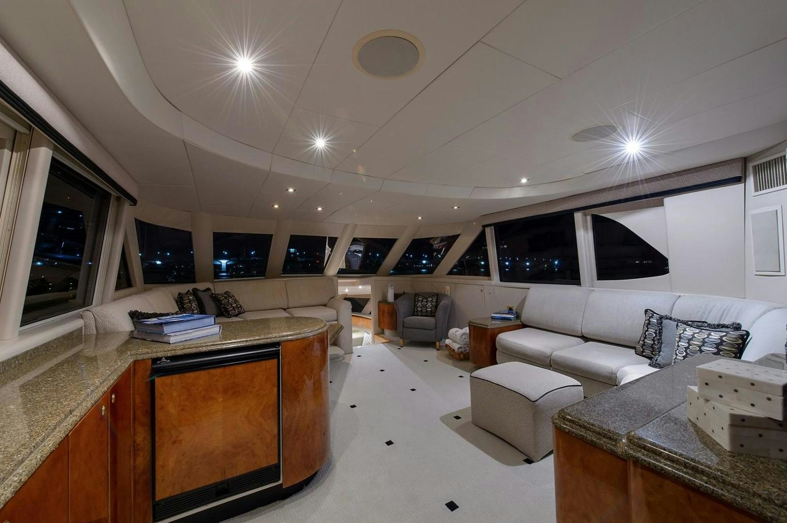 a large living room with a large window aboard BIG WAVE Yacht for Sale