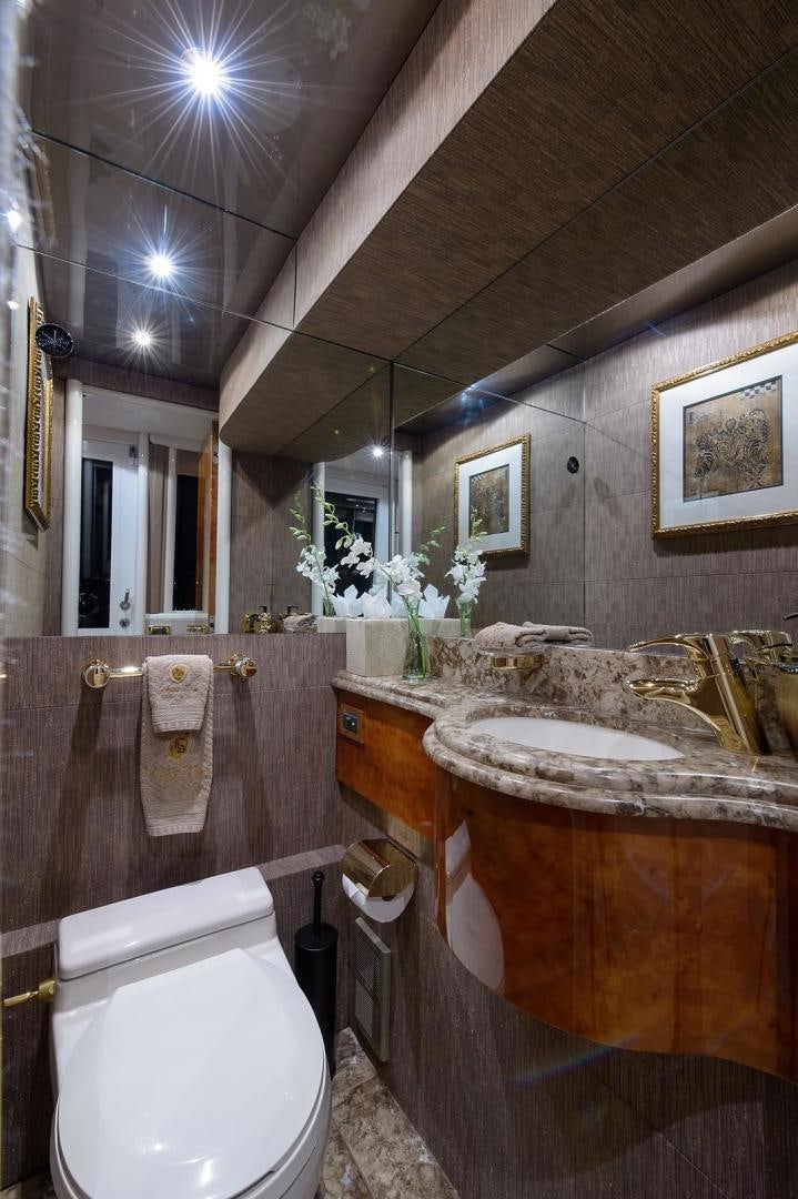 a bathroom with a sink and a toilet aboard BIG WAVE Yacht for Sale