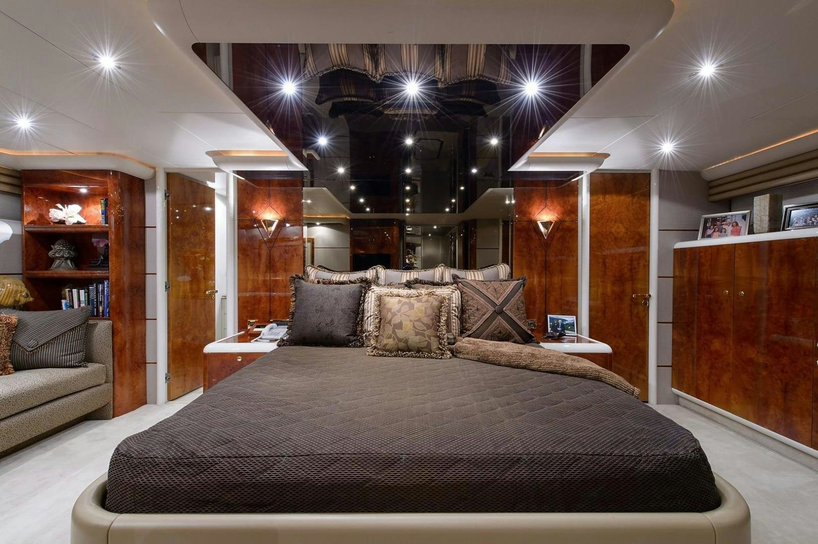 a large bed in a room aboard BIG WAVE Yacht for Sale
