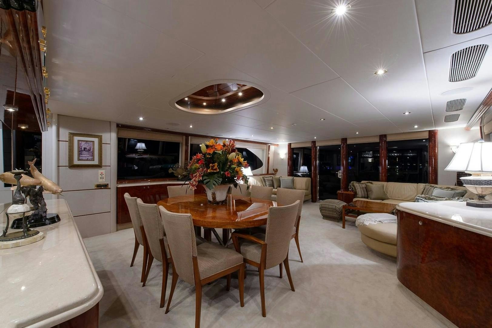 a large dining room with a table and chairs aboard BIG WAVE Yacht for Sale