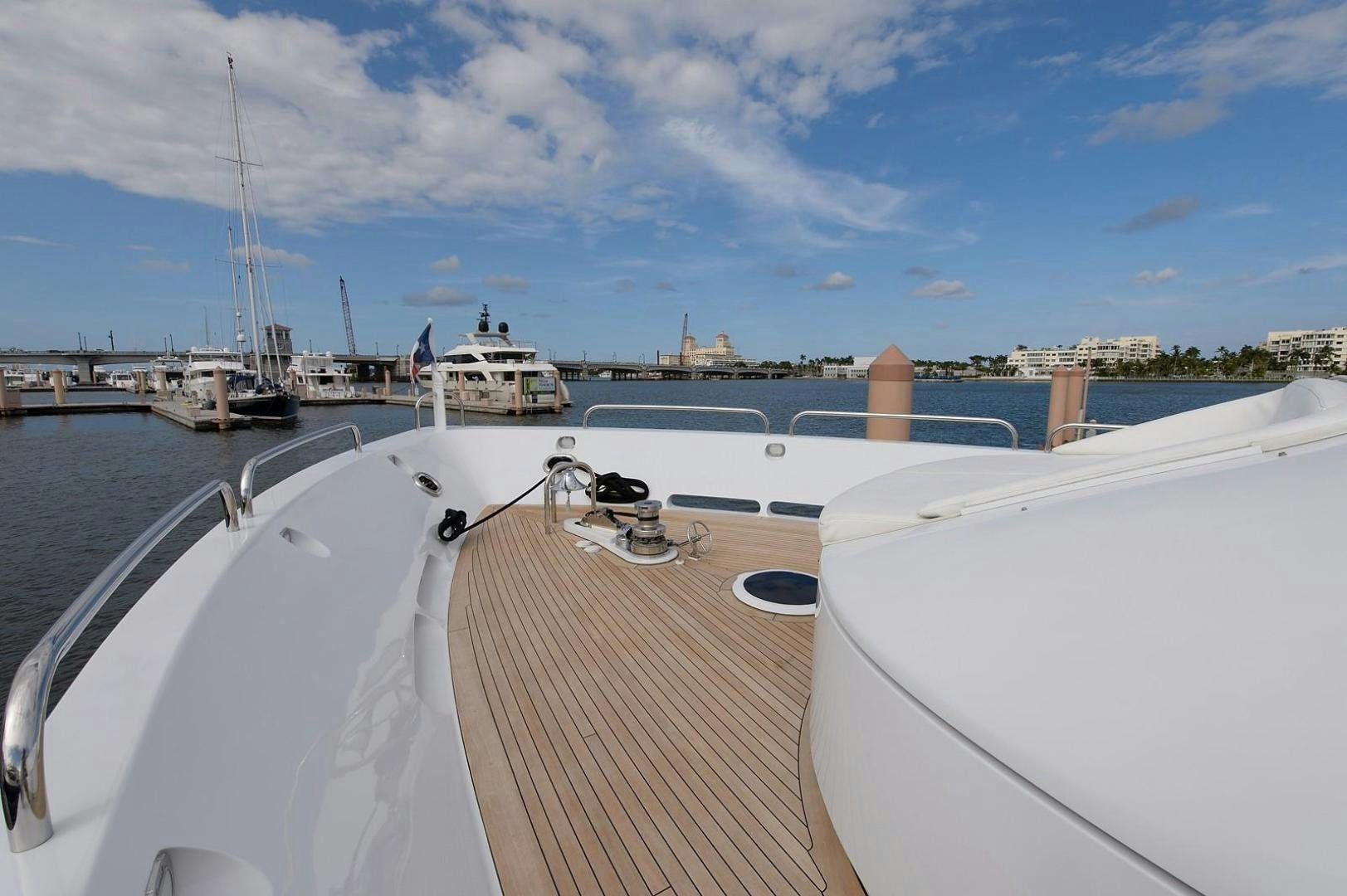 a boat is parked at a dock aboard BIG WAVE Yacht for Sale