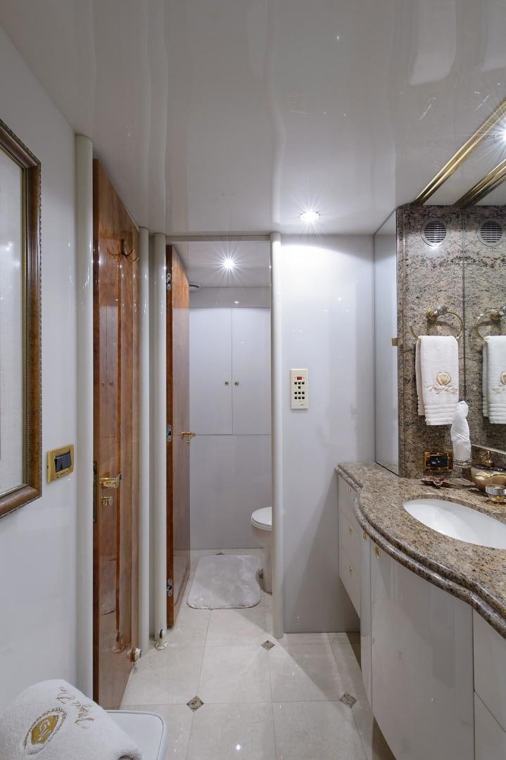 a bathroom with a sink and a toilet aboard BIG WAVE Yacht for Sale