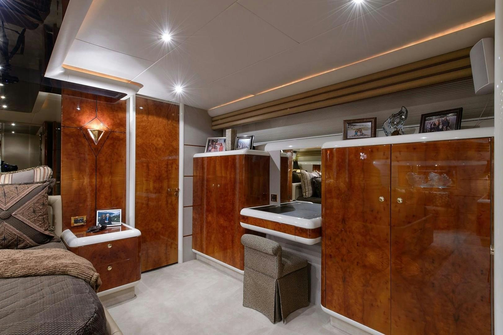 a room with a desk and a bed aboard BIG WAVE Yacht for Sale