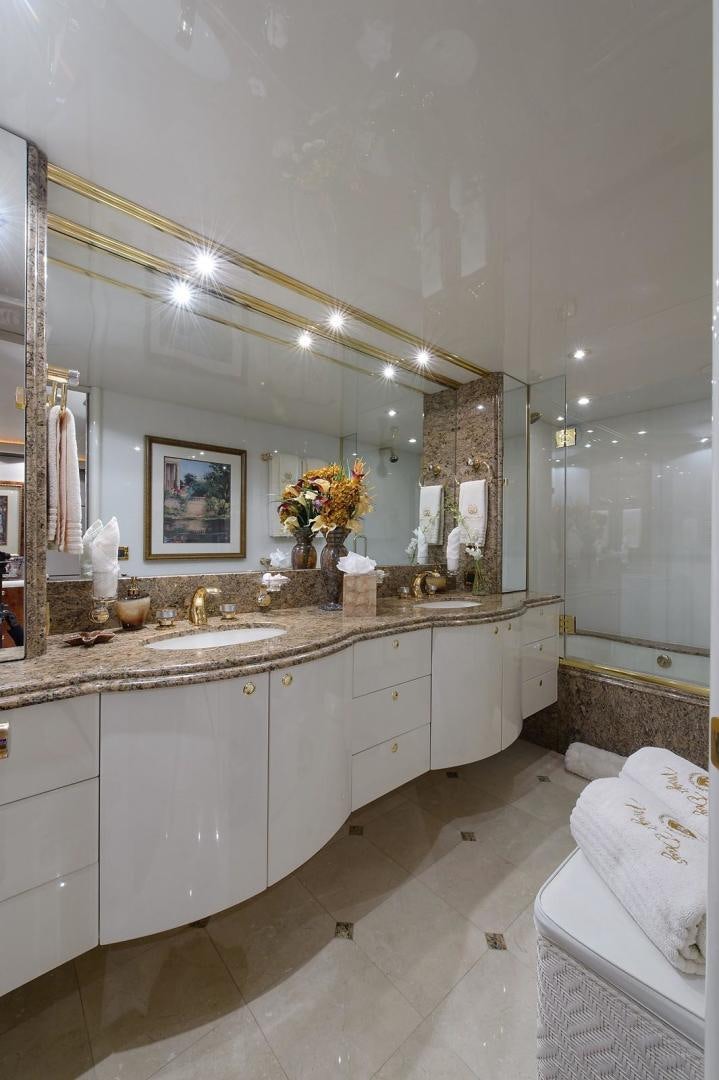 a bathroom with a large mirror aboard BIG WAVE Yacht for Sale