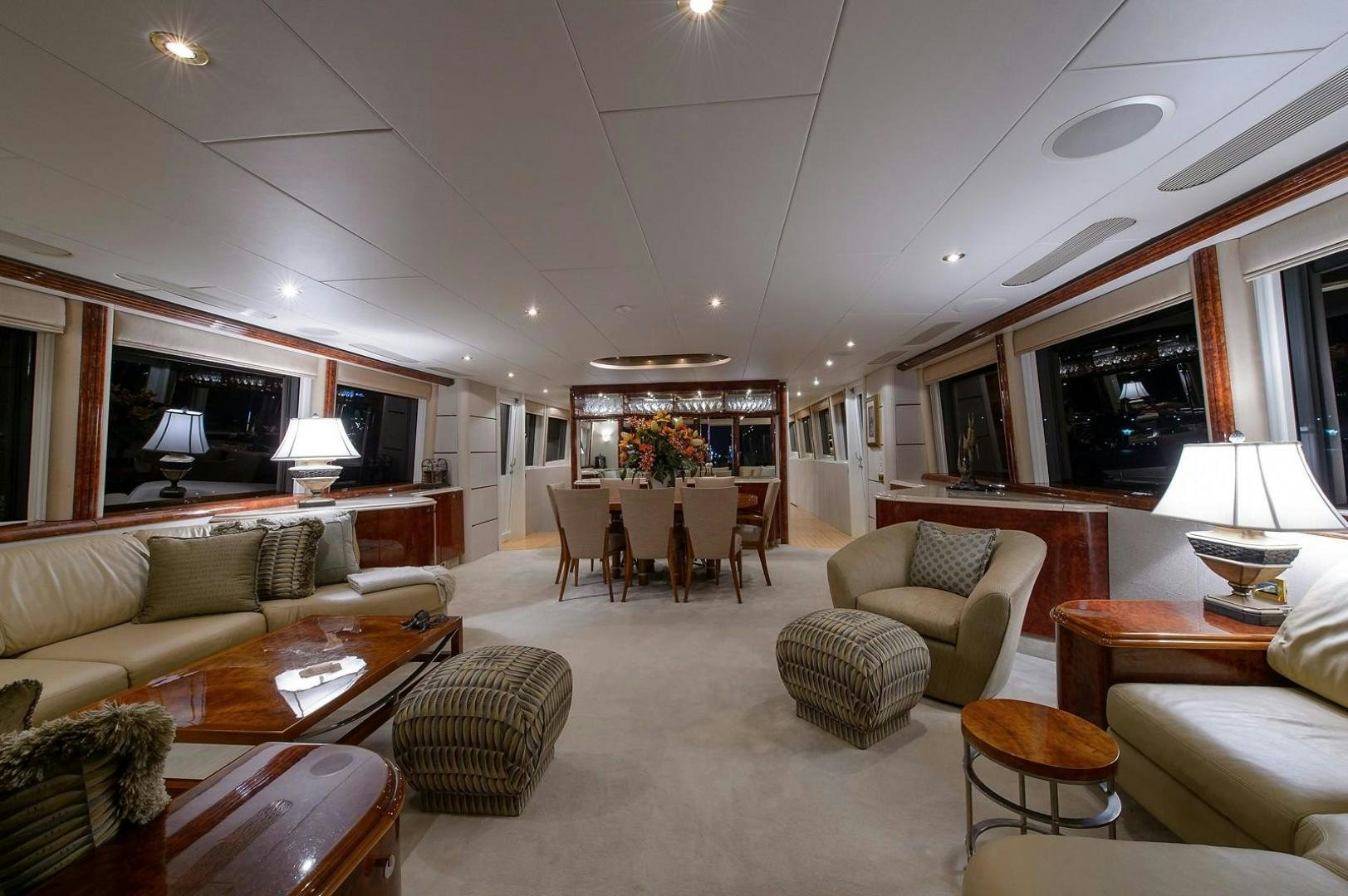 a living room with a couch and a table aboard BIG WAVE Yacht for Sale