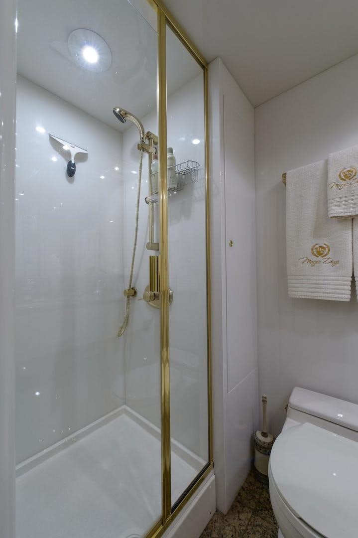 a bathroom with a shower unit aboard BIG WAVE Yacht for Sale