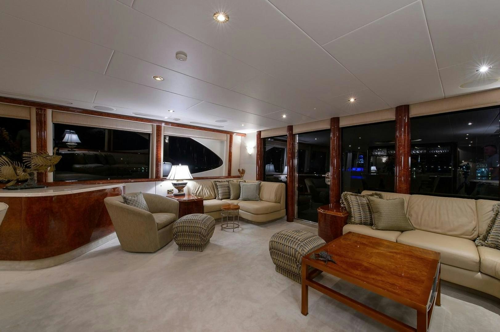 a living room with a large screen aboard BIG WAVE Yacht for Sale
