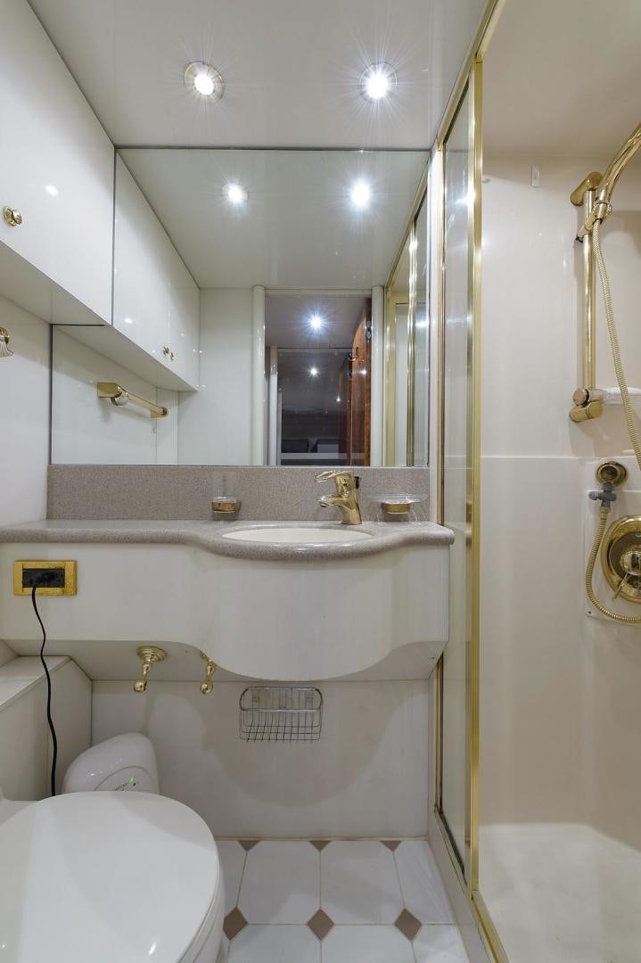 a bathroom with a sink and toilet aboard BIG WAVE Yacht for Sale