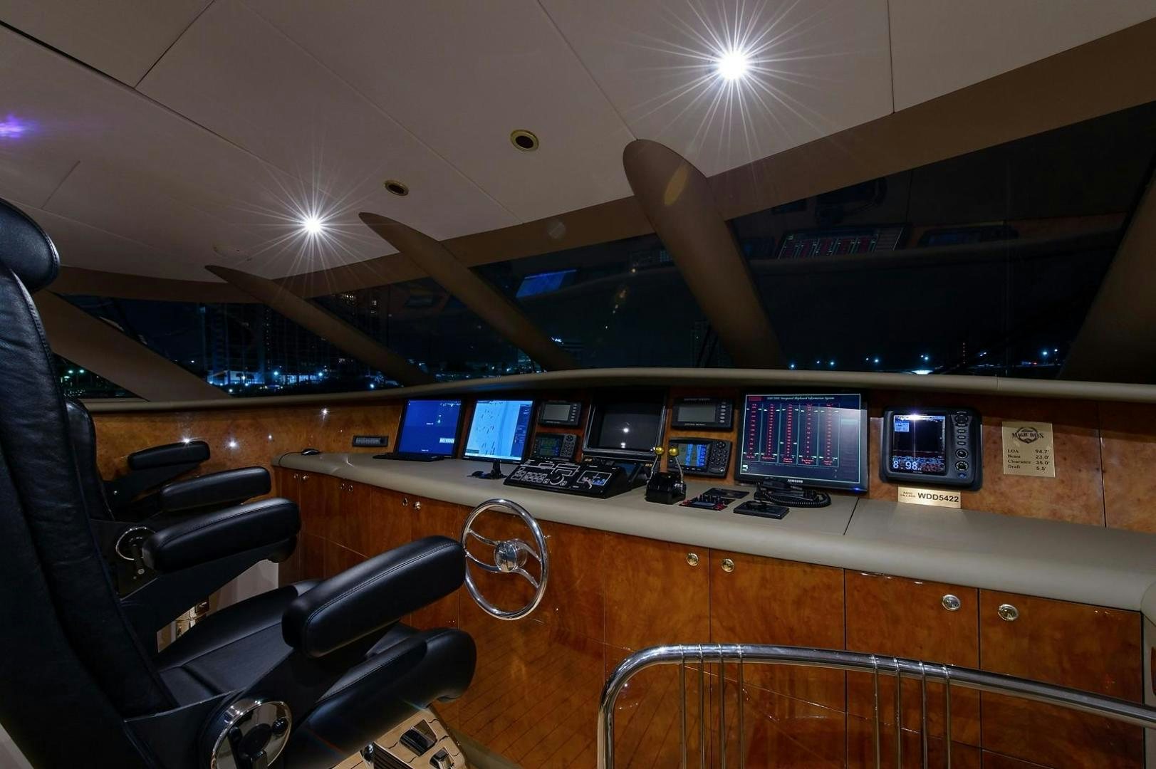 a room with many computers and monitors aboard BIG WAVE Yacht for Sale